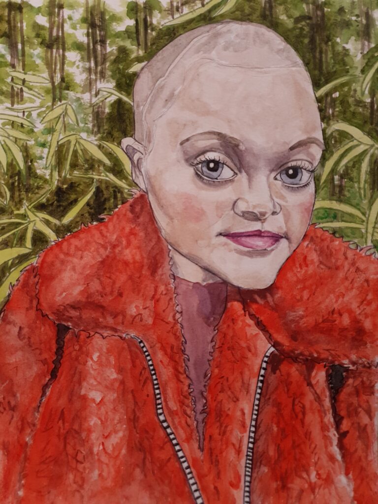 ID Artwork of very attractive woman with massive eyes, snub nose and slight smile, her eyes are blue grey. She has a buzz cut and a scar on her head, she is wearing a fluffy red/orange jacket and in the background can be seen bamboo plants and leaves.