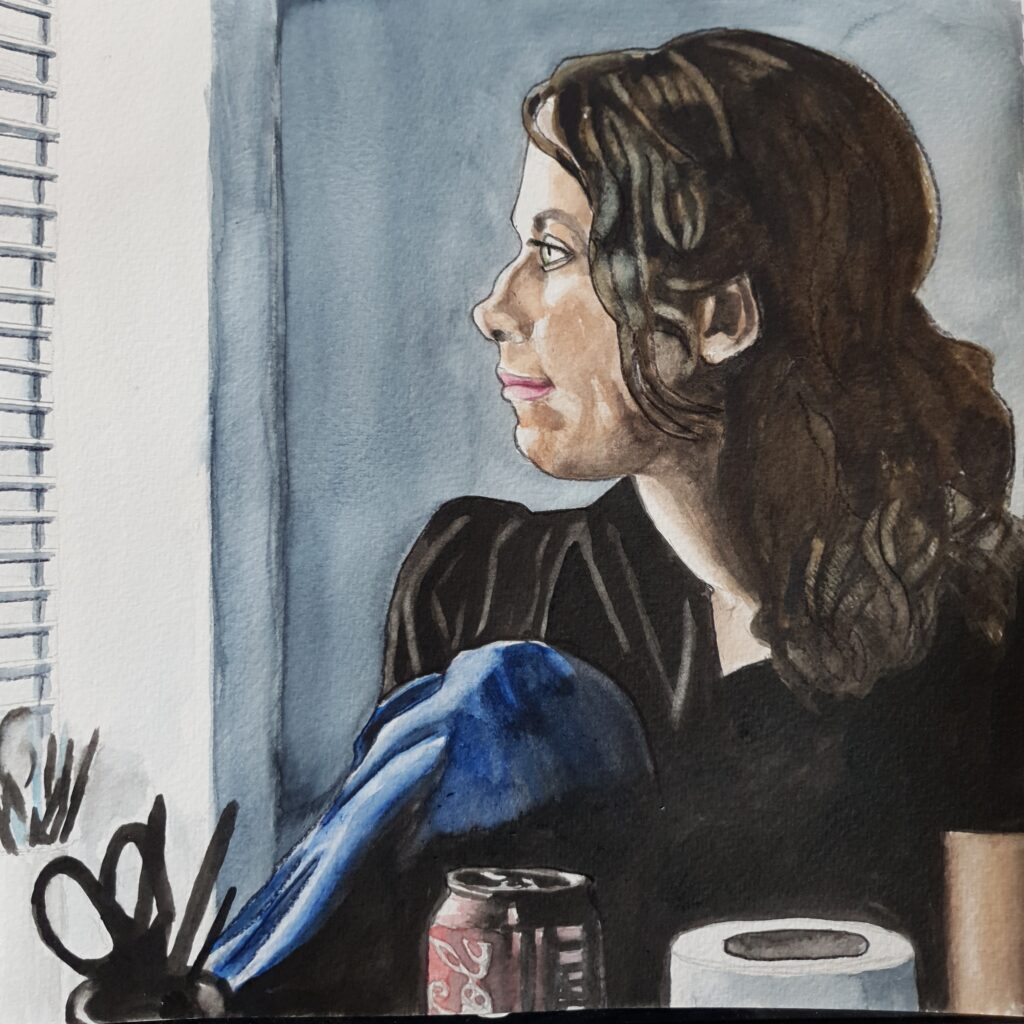 ID Woman in profile with a slight smile on her lips. her body is facing more towards us, and she has a leg raised up. Her hair is tied back, in front of her are a pot with some scissors in, a can of soft drink and a toilet roll . On the windowsill is a pot with paintbrushes and pens in it.