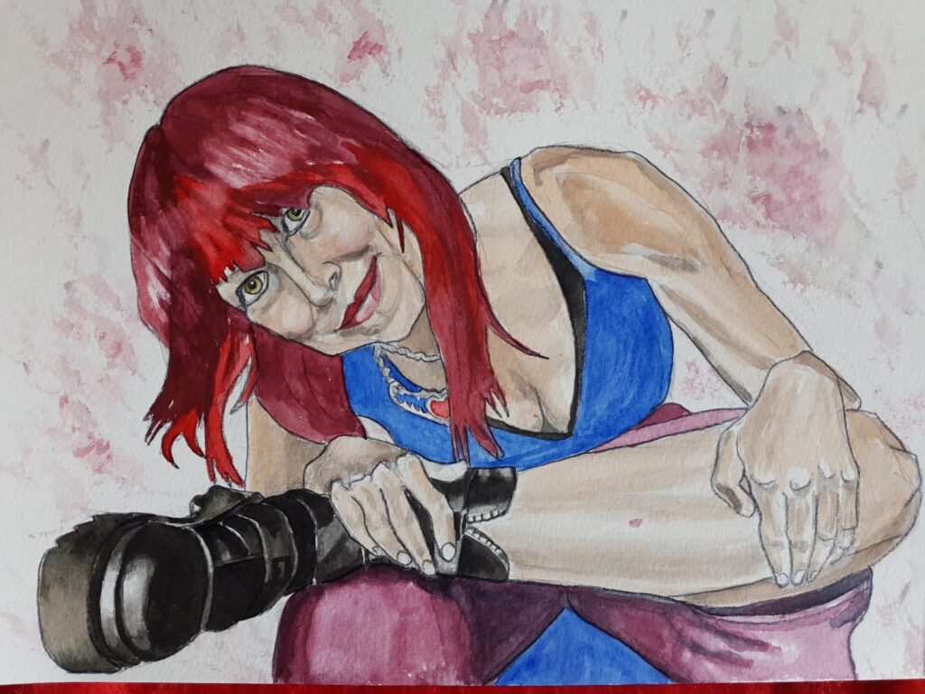 ID Self portrait, watercolour I have red feathered hair and am wearing red lipstick, I am sat on a chair and leaning forward and to one side, with one ankle balanced on the opposite knee. so my calf is horizontal and in view. On my calf can be seen a small lesion. I am wearing magnificent, black punky chunky boots, a blue vest top and a necklace with a red heart at the middle. I am wearing purpley/burgundy trousers. The background has been painted using the inspiration of the AI photograph that was used to diagnose the pre cancerous condition. That photograph is included in this post and shows a mottled pink and red area.