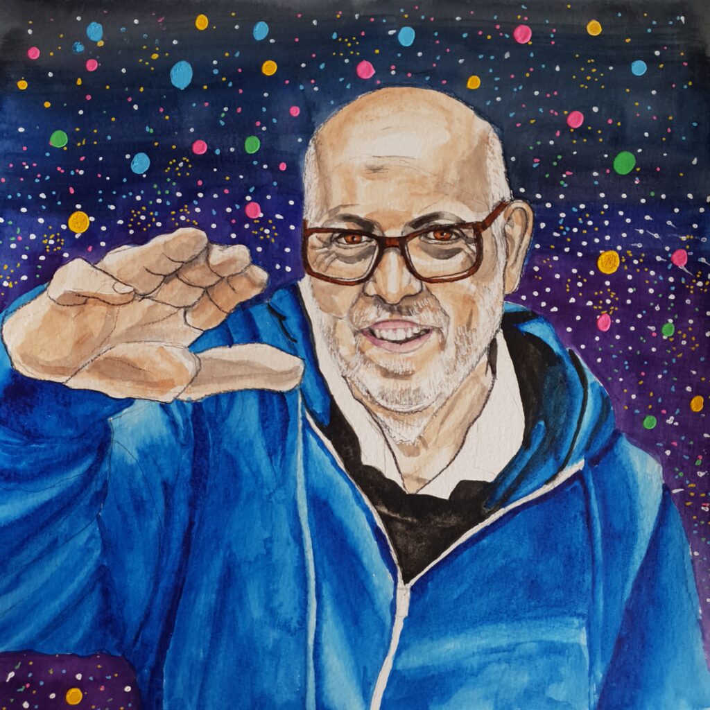 ID Watercolour painting of middle aged man with bald head and hair at the sides and he has a beard too, both of which are grey. He has brown eyes and brown glasses. He is wearing a blue hoodie with a black jumper underneath and a white shirt collar can be seen under his jumper. His right arm is raised to eye height indicating him floating through space. Mark is very into Dr Who and the background is of stars and asteroids in space.