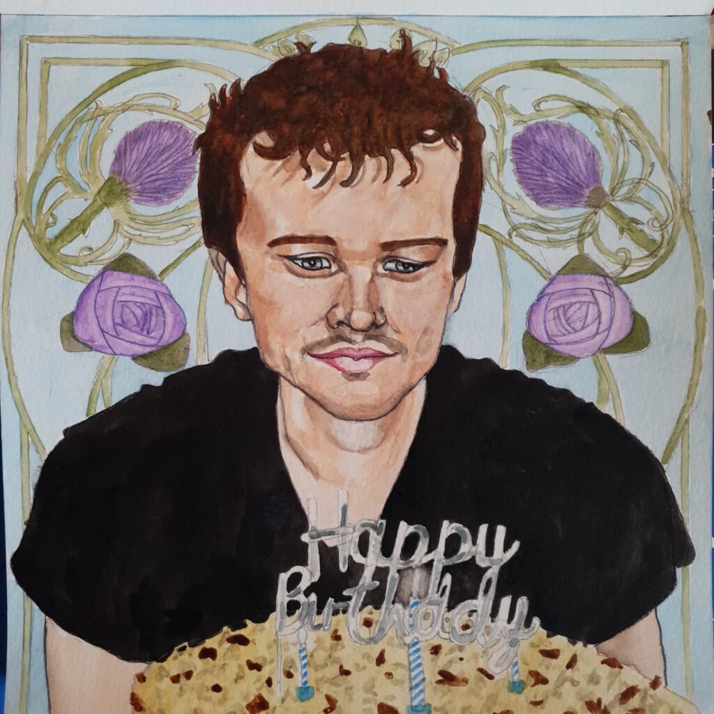 ID Watercolour painting of young man with dark, wavy hair, wearing a black t-shirt he has a moustache and is looking down at a large birthday cake in front of him, covered in dark and white chocolate shavings and buttercream. On top of the cake is a stand up " Happy Birthday"sign